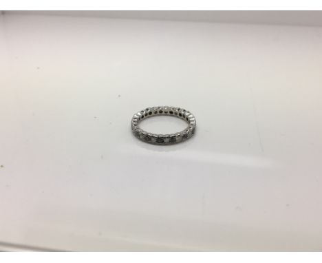 A 14ct black and white diamond eternity ring. Ring size M.