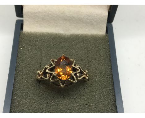 A 9ct gold ring set with a topaz.Approx size M