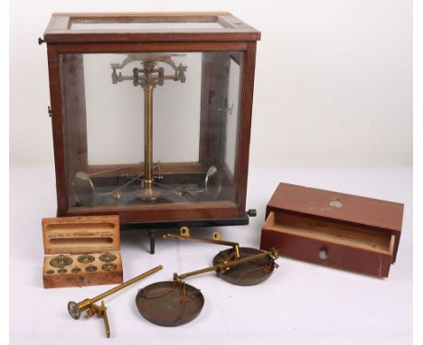 Vintage Weighing Scales: A set of quality made brass and metal scales housed in wood and glass case, with set of weights in b