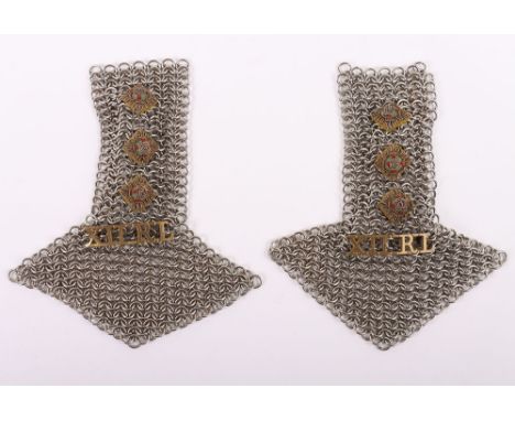 British 12th Royal Lancers Officers Shoulder Scales: A matched pair of white metal chain shoulder boards with pips and brass 