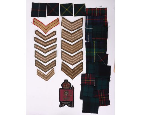 Collection of British Army Cloth Insignia. Lot includes an Irish Guards Csgt’s King’s Crown Arm Badge, various Tartan patches