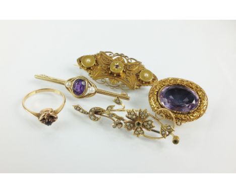 A Victorian ruby and diamond set bar brooch, stamped '15ct', together with a split pearl set spray brooch, an amethyst set ba