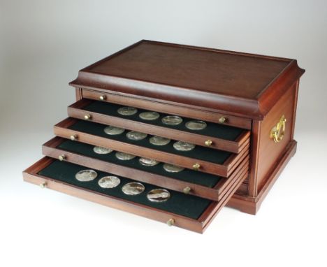 The 100 greatest masterpieces first edition silver proof set of medals, No. 232, contained within a six drawer wood cabinet w