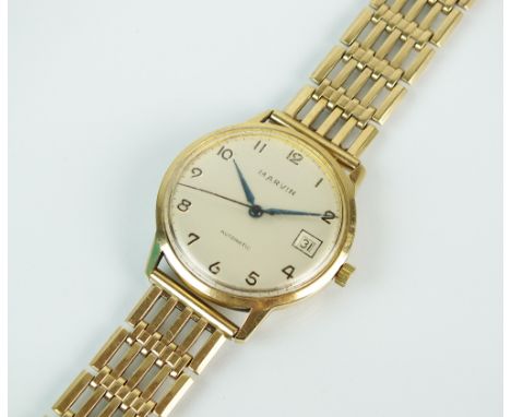 A Gentleman's 9ct gold Marvin Automatic bracelet watch, the silvered dial with black Arabic numerals, sweep seconds hand and 
