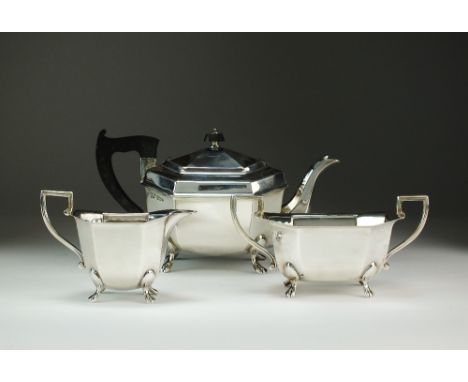 A three piece silver tea service, Emile Viner, Sheffield 1945, each piece of octagonal form, comprising; a teapot with ebonis