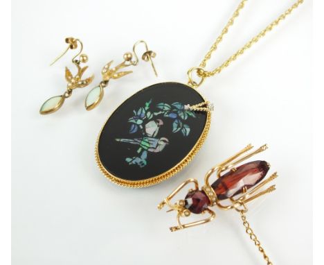 A garnet and seed pearl ant brooch, together with an inlaid opal pendant depicting two birds, suspended on 9ct gold chain and