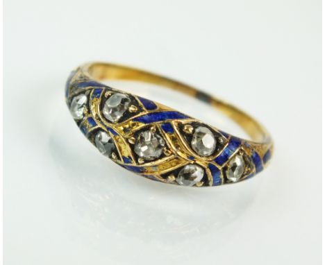 A 19th century diamond and enamel mourning ring, designed as seven old cut diamonds set within stylised blue enamel ribbons, 