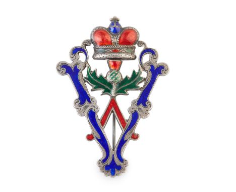 of open form, modelled as a 'V' with a central crown above a thistle motif, with red, green and blue enamel detail throughout