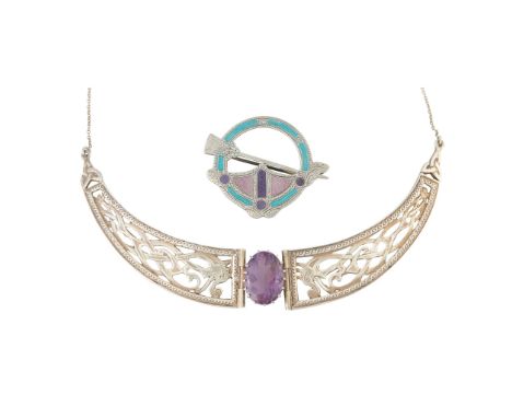 claw set with an oval cut amethyst flanked to either side by Celtic beast motif panels, stamped Scotland SILVER, G.A.A.; toge
