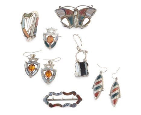 comprising a pair of earrings and brooch, each modelled as a shield, claw set with an oval citrine in a pierced border set wi