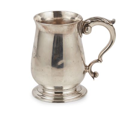 attributed to Glasgow circa 1760 single mark H&M, of typical baluster form engraved crest and motto, scroll handle with leaf 