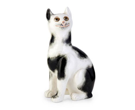 with applied glass eyes and sponged black on white decoration, impressed maker's mark WEMYSS WARE/ R. H. &amp; S., printed re