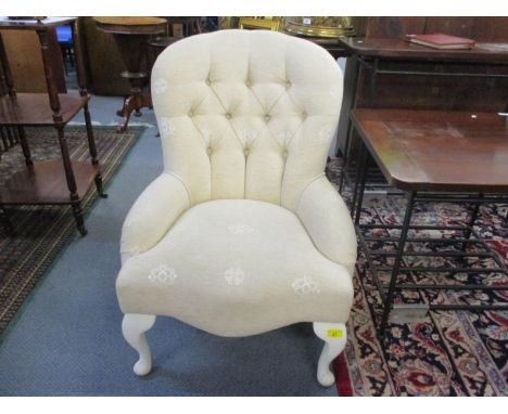 A button back upholstered chair 
