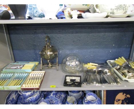 A quantity of Victorian and later silver plate to include a Victorian tea kettle on stand, a glass and silver plated butter d