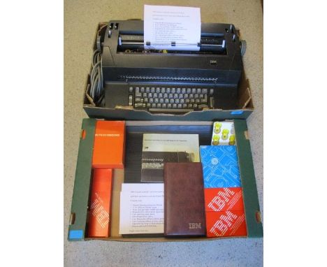 An IBM Selectric model 82 typewriter in mat black, golf ball type electric typewriter, date 28/2/1979, with cased golf balls,