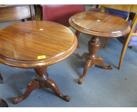 A pair of reproduction cherry wood lamp tables on tripod bases 