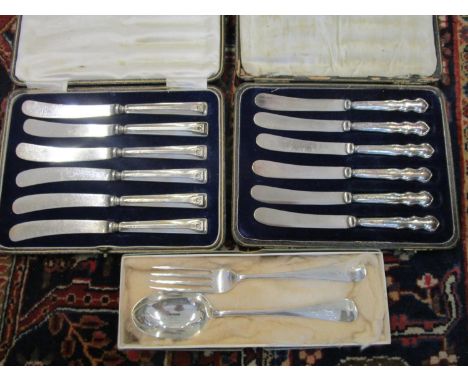 Two cased sets of silver handled butter knives and rat tail silver spoon and fork, London 1927/28, mark for Robert Pringle &a