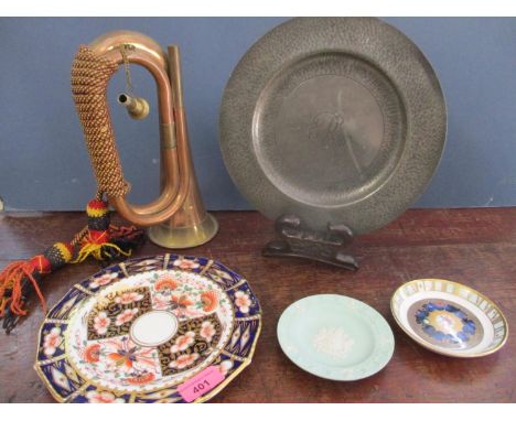 An early 20th century copper bugle, a 19th century pewter plate, a Derby plate and two others, together with a Chinese carved