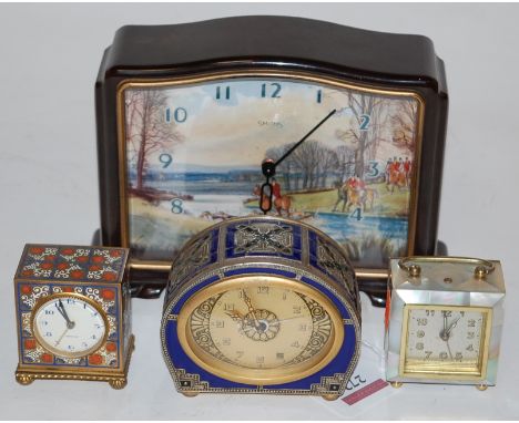 A mid 20th century Smiths bakelite cased mantel clock the dial with lithograph printed hunting scene, together with a Zenith 