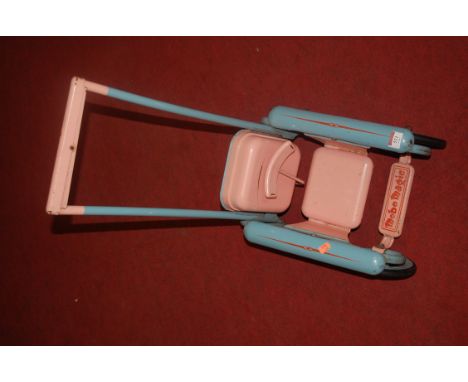 A 1960s tinplate Mobo Magic dolls pram 