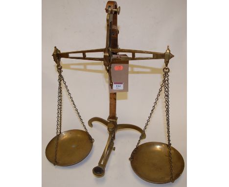 A pair of early 20th century brass beam scales, stamped Miles & Co