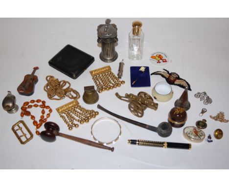 A box of miscellaneous items to include; miniature brass cannon, table cigarette lighter, scent bottles, costume jewellery et