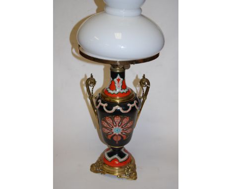 A Victorian stoneware and gilt brass mounted pedestal oil lamp, having an opaque glass shade, twin square cut applied scroll 