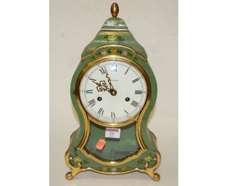 A reproduction French style green painted and gilt decorated mantel clock, having enamelled dial with Roman numerals, and eig