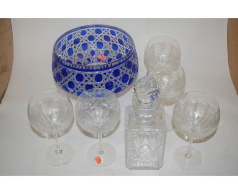 A large heavy blue overlaid and cut glass pedestal bowl together with a cut glass decanter and stopper, **five** wine goblets