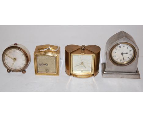 A mid-20th century French brass cased travel alarm clock; together with three other travel clocks (4)
