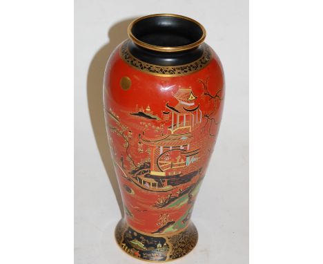 An early 20th century Carltonware vase, of baluster form, on a deep orange ground relief decorated with Chinese figural scene