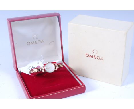 An Omega ladies 9ct gold cased wrist watch having a signed champagne dial, baton markers, manual wind movement, 2cm (excludin