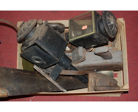 A box of miscellaneous items to include Victorian coaching lamps, hand tools, flat iron etc