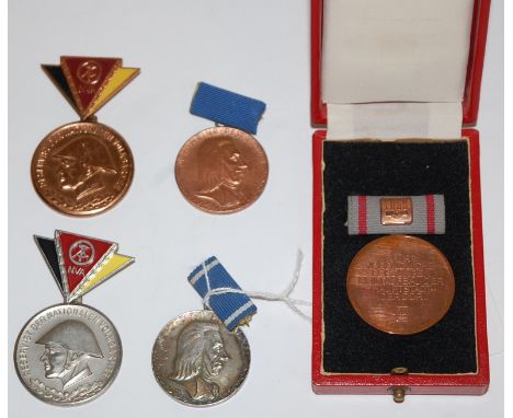 A GDR Border Force medal in a fitted leather case, together with National Peoples Army Reservist medal x2 and East German Pes