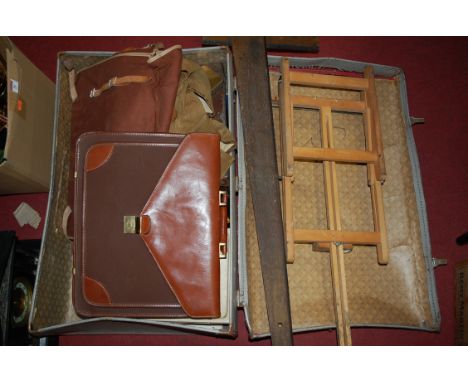A trunk of assorted artists materials and accessories; together with a folding wooden easel