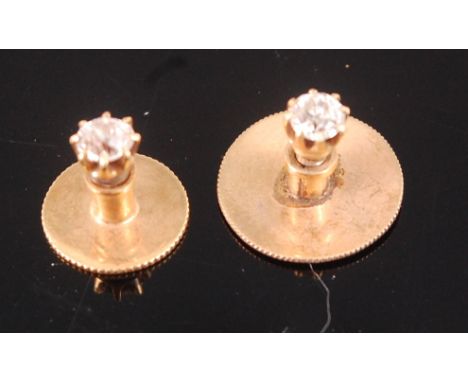 A 15ct gold diamond set dress button, the claw set old brilliant weighing approx. 0.2ct; together with matching collar stud (