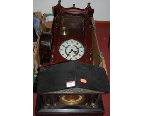 An early 20th century black slate mantel clock of architectural form, having enamelled dial with Arabic numerals and eight da