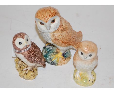 A small boxed Beswick model of an owl, impressed Beswick England mark verso; together with two other loose Beswick owls (3)