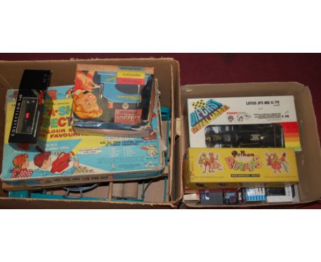 Two boxes of miscellaneous childrens toys and games to include; boxed Pelham SS Cowgirl puppet, diecast metal model of a Lotu