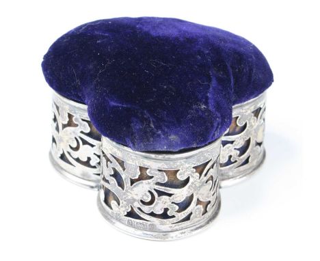 An Edwardian silver trinket box sleeve, of pierced trefoil shape, having a purple felt and silk lined interior, maker William