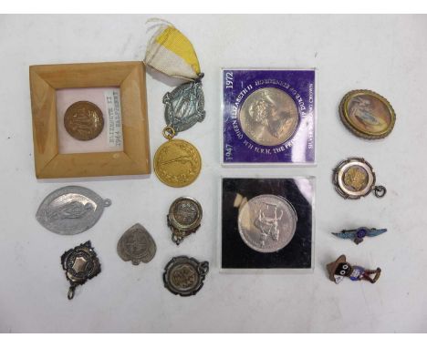 A collection of mixed coins, badges, medallions, to include an RAF enamel decorated sweetheart brooch, commemorative crowns, 