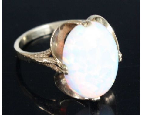 A 9ct yellow gold and synthetic opal dress ring, the synthetic opal measuring approx 14.5 x 10.9mm, size Q, gross weight 3.3g