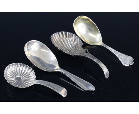 A George III silver tea caddy spoon, having a scallop shaped bowl and bright cut engraved stem, maker possibly John Thropp, B