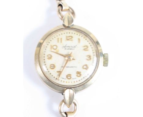 An Accurist lady's 9ct gold cased bracelet watch, having a signed silvered dial, manual wind movement, and on snakelink brace