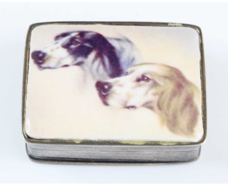 A 20th century Continental silver patch / pill box of rectangular form, the hinged cover enamel decorated with two dogs heads