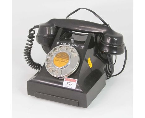 A vintage style black rotary telephone
