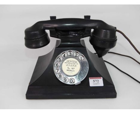 An early 20th century black cased rotary telephone