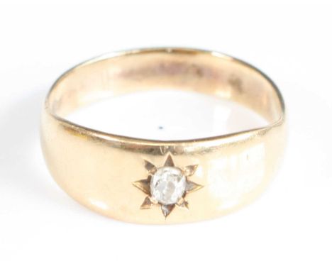 A yellow metal diamond dress ring, having an old cushion cut diamond in a star setting, size J, gross weight 2.2g, diamond we