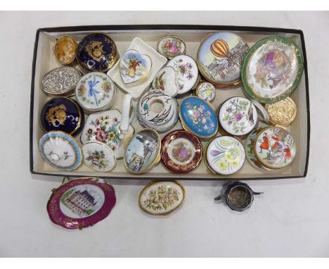 A collection of enamel and porcelain patch boxes and trinkets