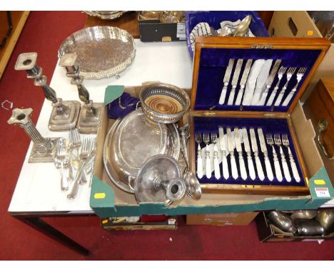 A collection of silver plated wares, to include a Corinthian column table candlestick, wine coaster, chamberstick etc 